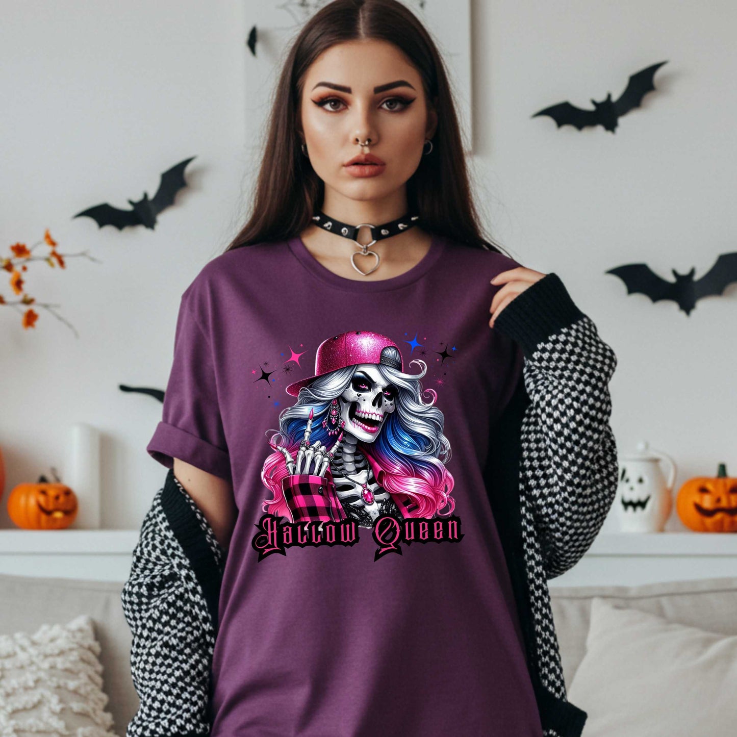 Featuring a glam skeleton with flowing pastel hair, pink flannel, and a glittery hat, she’s clearly been slaying the afterlife runway since 1802. Perfect for the girls who haunt with heels, sparkle under the moonlight, and don’t have time for basic. Serve full-body sass while you sashay through spooky season.