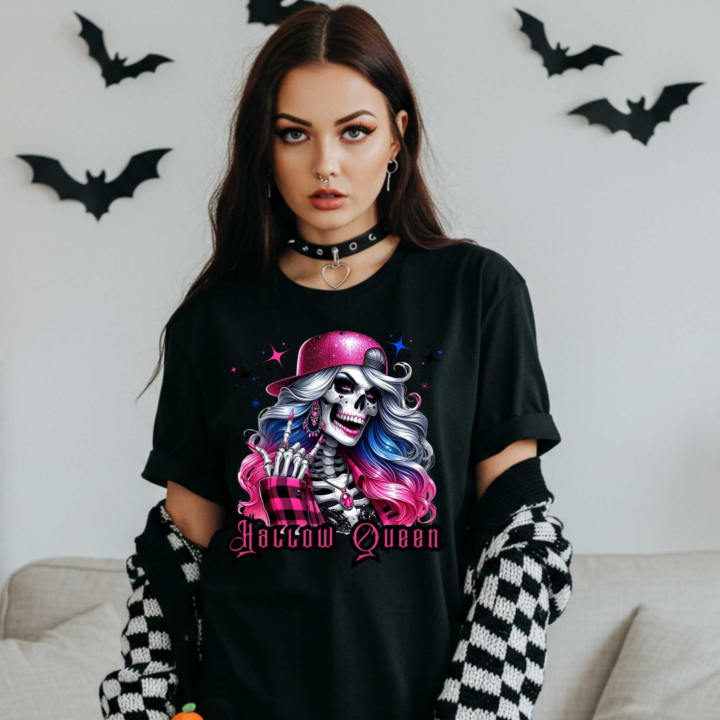 Featuring a glam skeleton with flowing pastel hair, pink flannel, and a glittery hat, she’s clearly been slaying the afterlife runway since 1802. Perfect for the girls who haunt with heels, sparkle under the moonlight, and don’t have time for basic. Serve full-body sass while you sashay through spooky season.