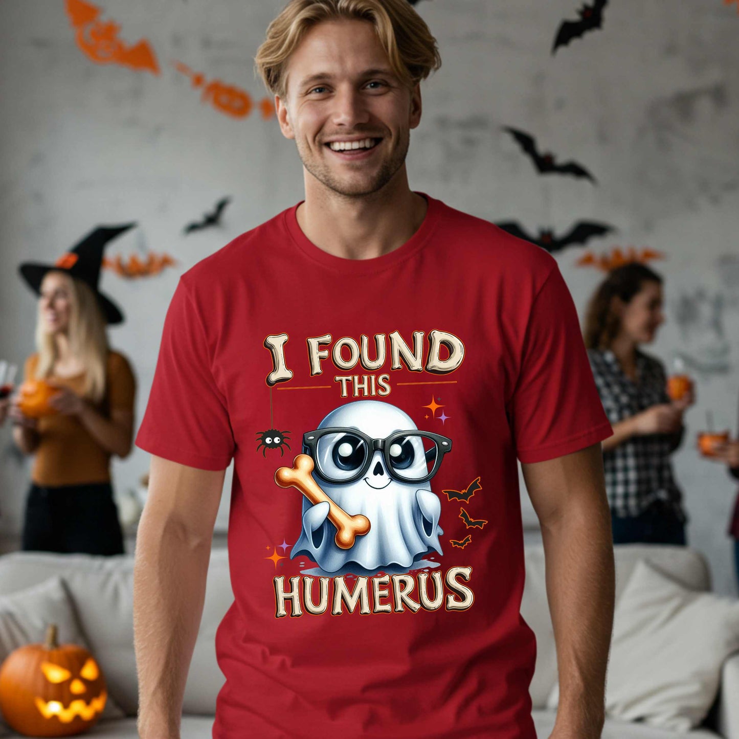 Bone-afide hilarious. This “I Found This Humerus” tee is the ultimate Halloween dad joke wrapped in spooky cute style. Featuring a ghost rocking nerdy glasses and proudly holding a humerus bone like it just cracked itself up—because it did.