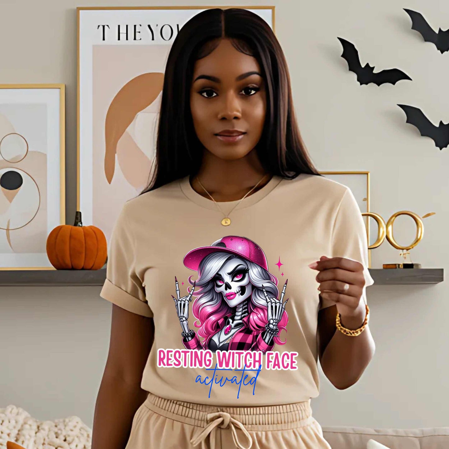 Warning: Resting Witch Face Activated. This glam skeleton came back from the dead just to not deal with your nonsense. With flawless pink curls, a sparkly cap, and that iconic “don’t test me” stare, this tee is giving spooky sass in full effect. Perfect for ghouls who slay silently, serve looks with zero expression, and ghost negativity on sight.