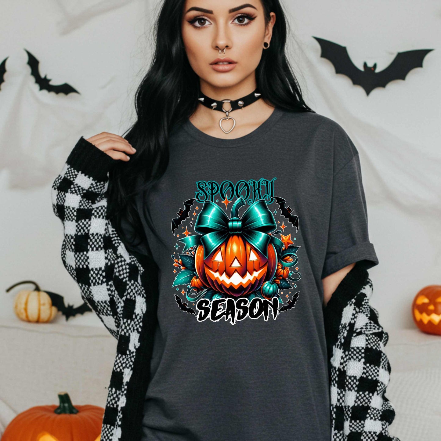 Step aside basic witches, this pumpkin came to SLAY. Our Spooky Season tee brings the perfect mix of creepy and cute—featuring a fierce jack-o’-lantern crowned with a bold teal bow and surrounded by gothic glam accents.