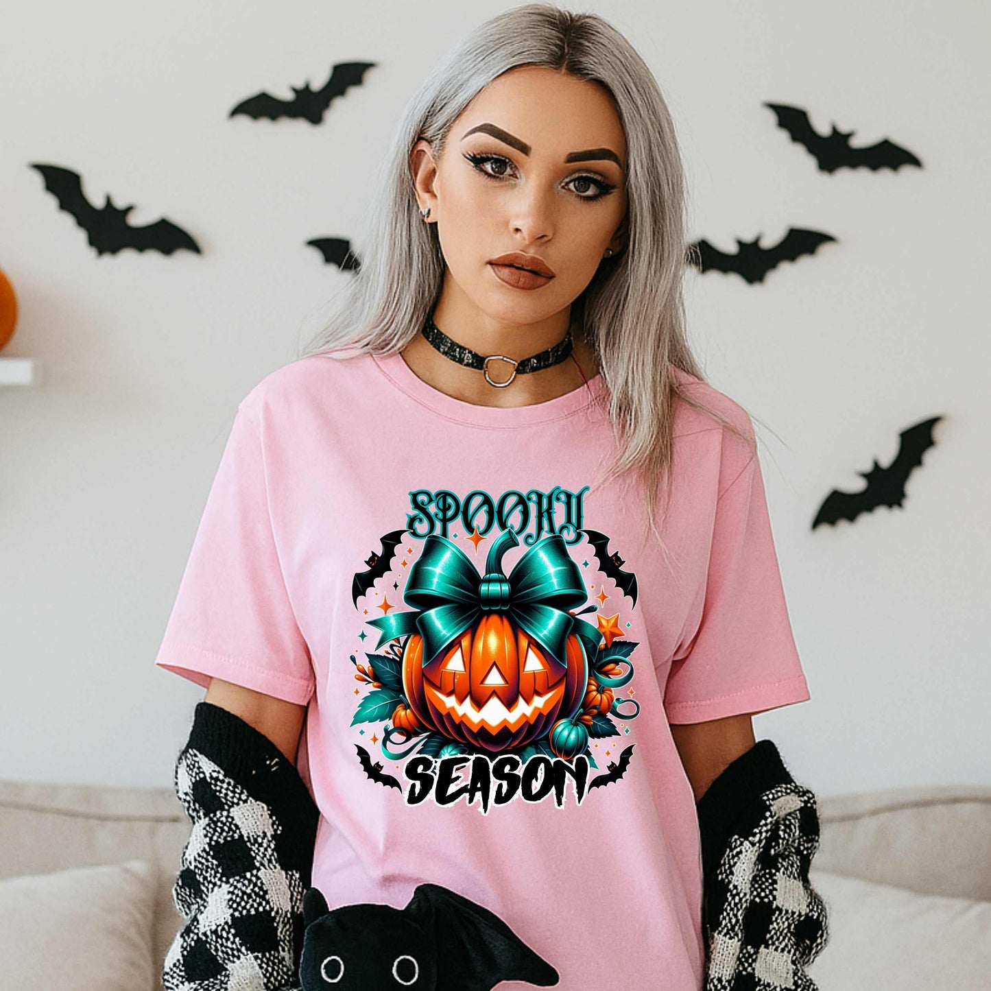 Step aside basic witches, this pumpkin came to SLAY. Our Spooky Season tee brings the perfect mix of creepy and cute—featuring a fierce jack-o’-lantern crowned with a bold teal bow and surrounded by gothic glam accents.