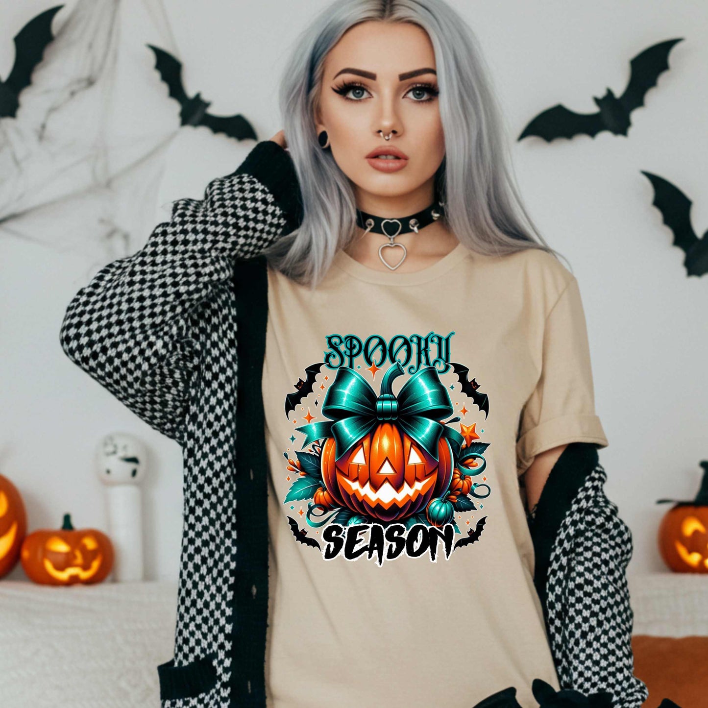Step aside basic witches, this pumpkin came to SLAY. Our Spooky Season tee brings the perfect mix of creepy and cute—featuring a fierce jack-o’-lantern crowned with a bold teal bow and surrounded by gothic glam accents.