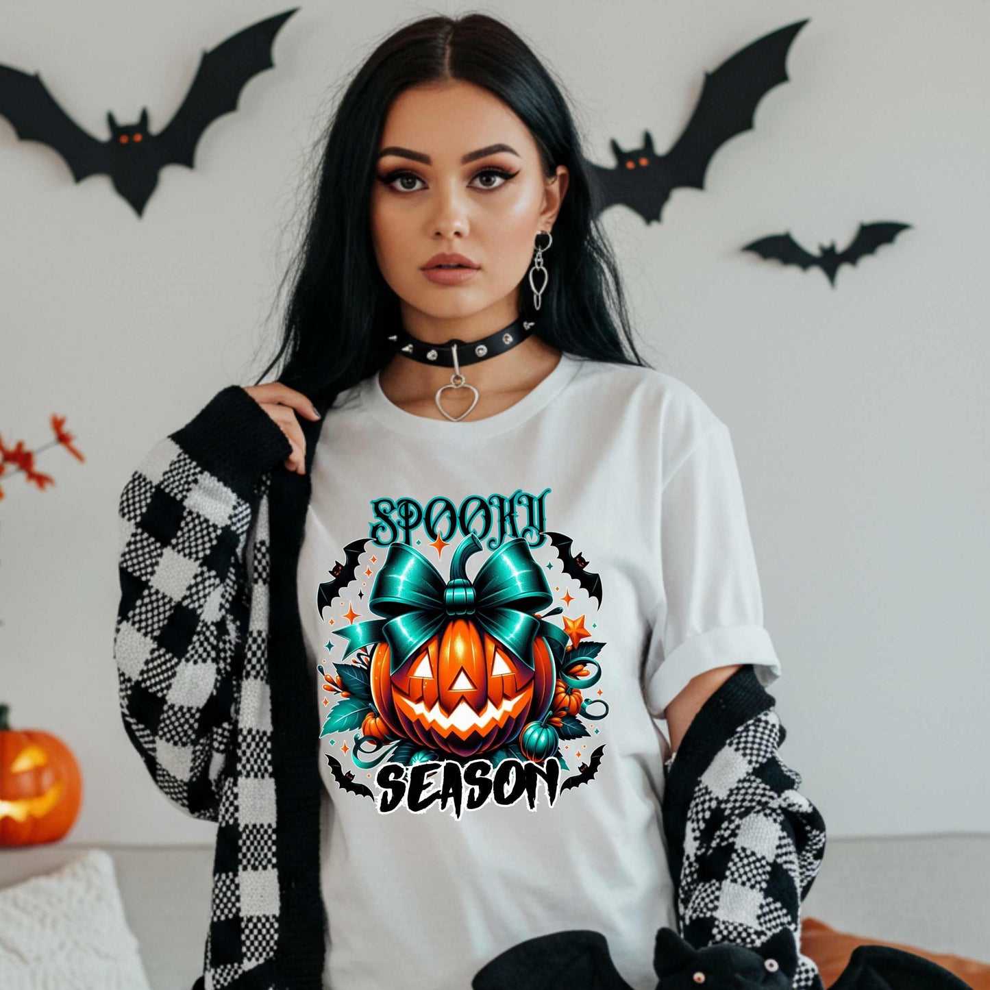 Step aside basic witches, this pumpkin came to SLAY. Our Spooky Season tee brings the perfect mix of creepy and cute—featuring a fierce jack-o’-lantern crowned with a bold teal bow and surrounded by gothic glam accents.