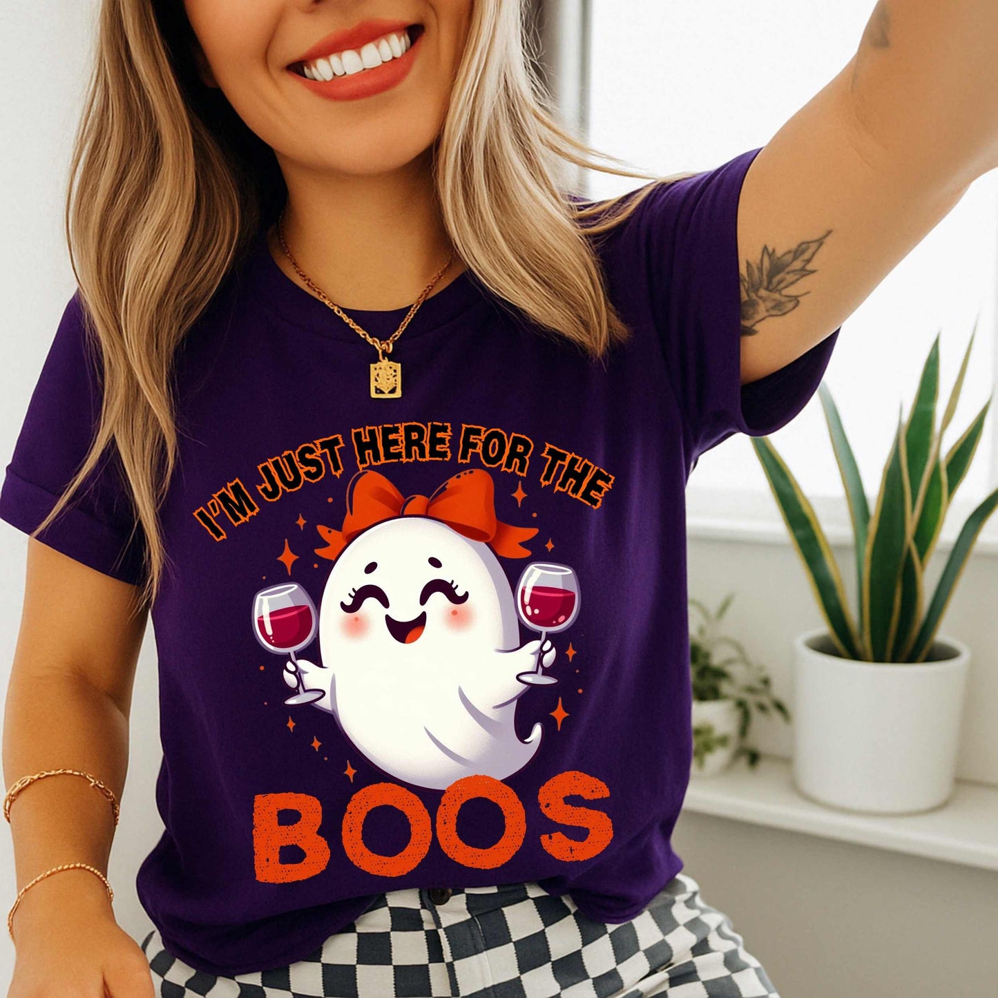 This hilarious “I’m Just Here for the Boos” tee features a bubbly little ghost with a bow, two glasses of red in hand, and zero shame in her sip game. She’s classy, a little sassy, and probably on her third pour. Perfect for Halloween parties, girls’ nights, wine tastings, or just pretending your spooky spirit isn’t fueled entirely by cabernet.