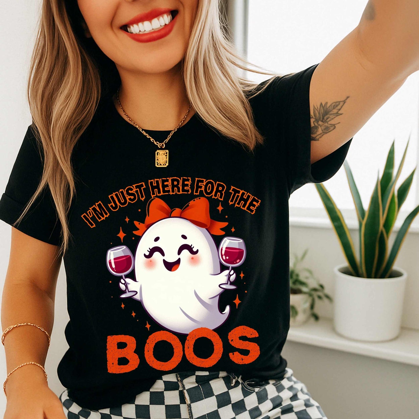 This hilarious “I’m Just Here for the Boos” tee features a bubbly little ghost with a bow, two glasses of red in hand, and zero shame in her sip game. She’s classy, a little sassy, and probably on her third pour. Perfect for Halloween parties, girls’ nights, wine tastings, or just pretending your spooky spirit isn’t fueled entirely by cabernet.