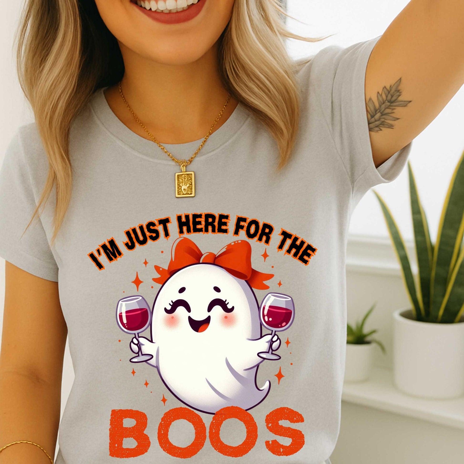 This hilarious “I’m Just Here for the Boos” tee features a bubbly little ghost with a bow, two glasses of red in hand, and zero shame in her sip game. She’s classy, a little sassy, and probably on her third pour. Perfect for Halloween parties, girls’ nights, wine tastings, or just pretending your spooky spirit isn’t fueled entirely by cabernet.