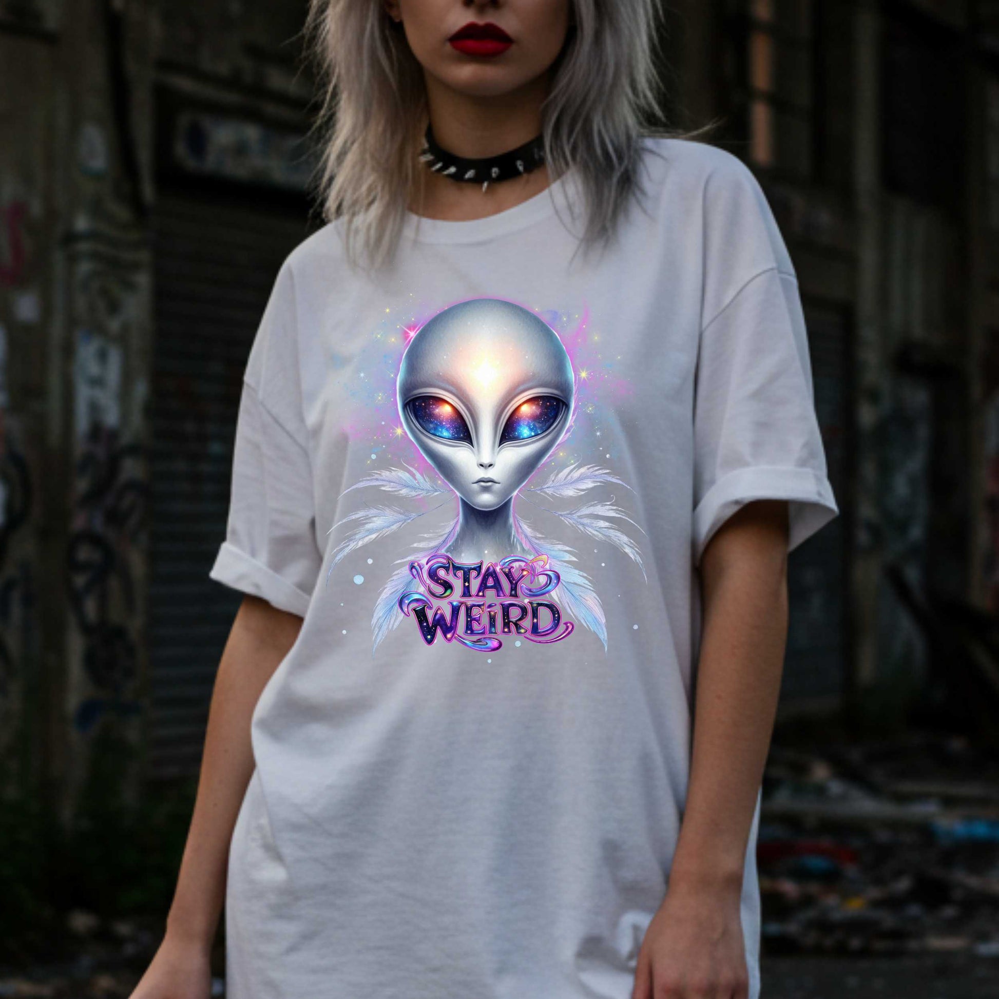 Channel your inner cosmic weirdo with this bold Alien Stay Weird graphic tee. Designed for the unapologetically different, this spacey shirt features an ethereal extraterrestrial with galaxy eyes and major interdimensional energy. 