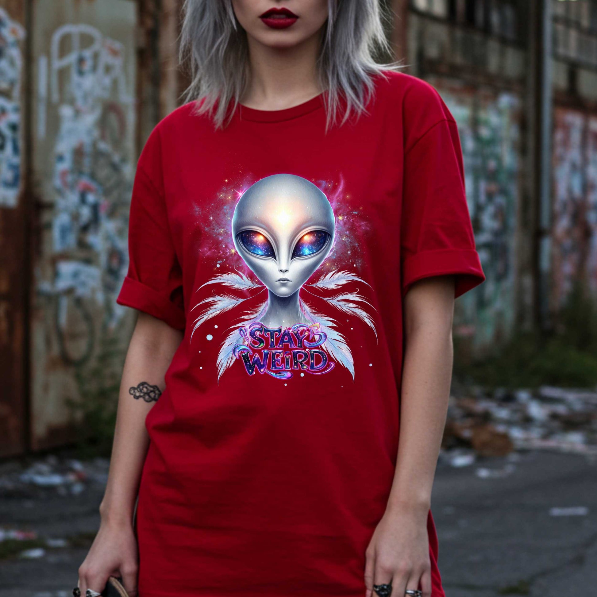 Channel your inner cosmic weirdo with this bold Alien Stay Weird graphic tee. Designed for the unapologetically different, this spacey shirt features an ethereal extraterrestrial with galaxy eyes and major interdimensional energy. 