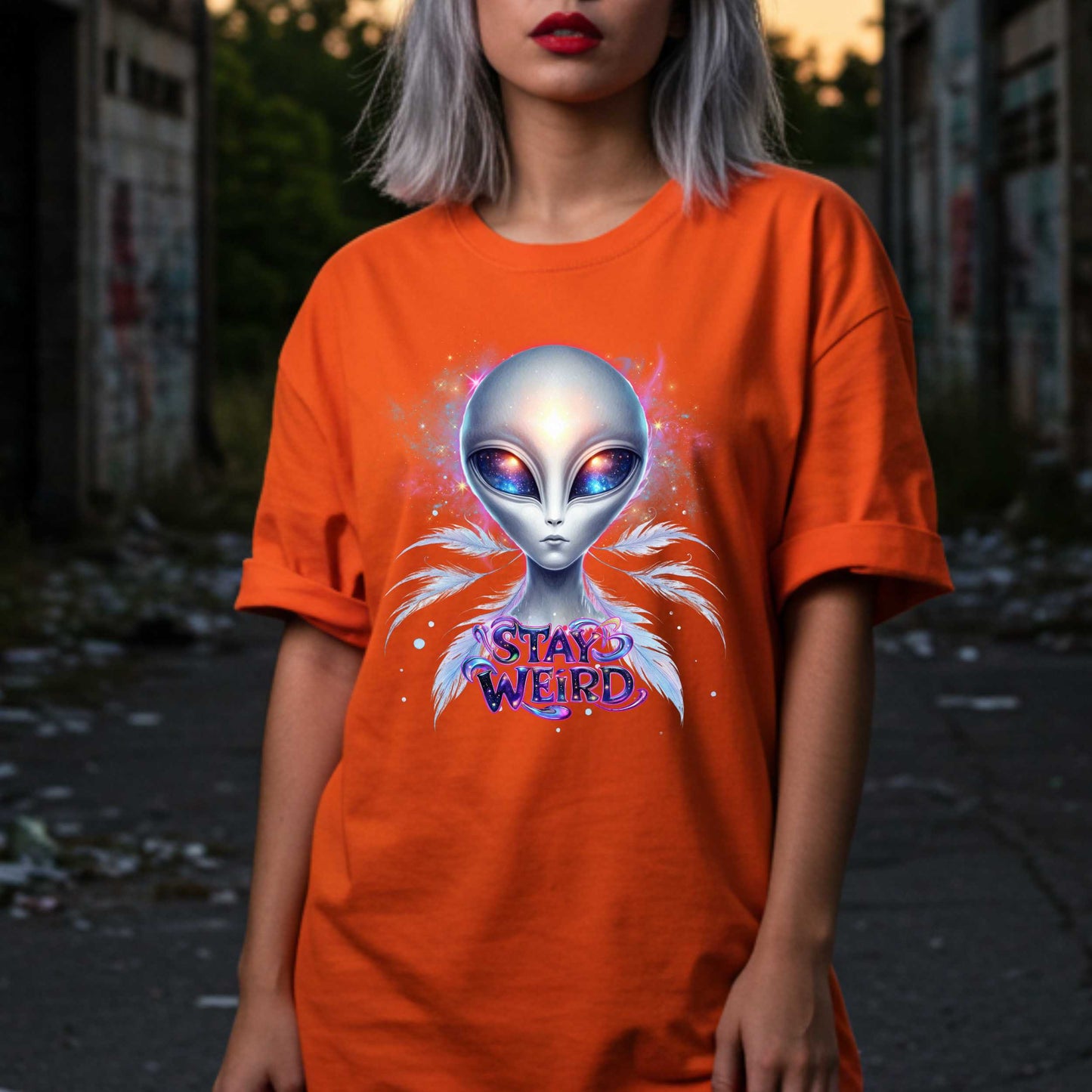 Channel your inner cosmic weirdo with this bold Alien Stay Weird graphic tee. Designed for the unapologetically different, this spacey shirt features an ethereal extraterrestrial with galaxy eyes and major interdimensional energy. 