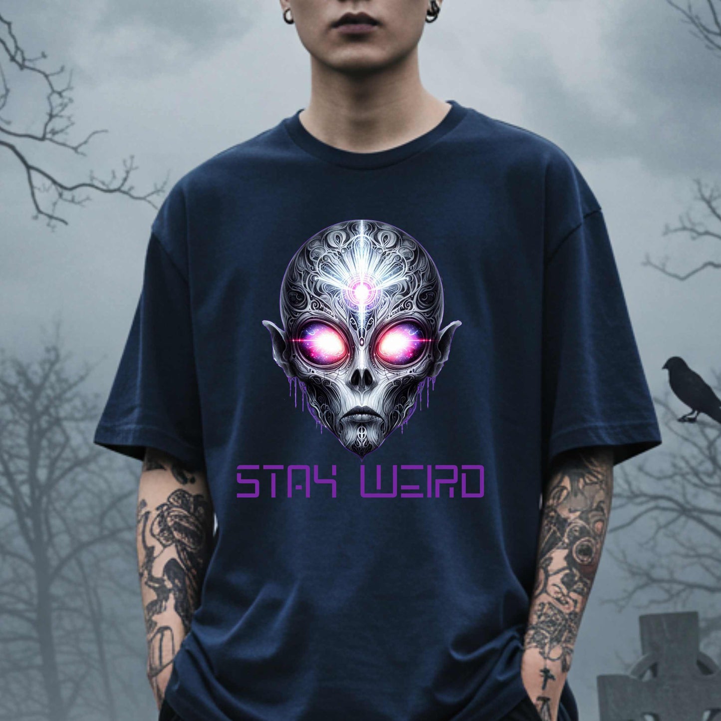 This Stay Weird alien shirt is for the cosmic misfits, the night-dwellers, and the ones who don’t just embrace their weirdness—they glorify it. Featuring a hauntingly detailed alien face with glowing eyes and third-eye vibes, this tee is equal parts spooky, surreal, and unapologetically bold.