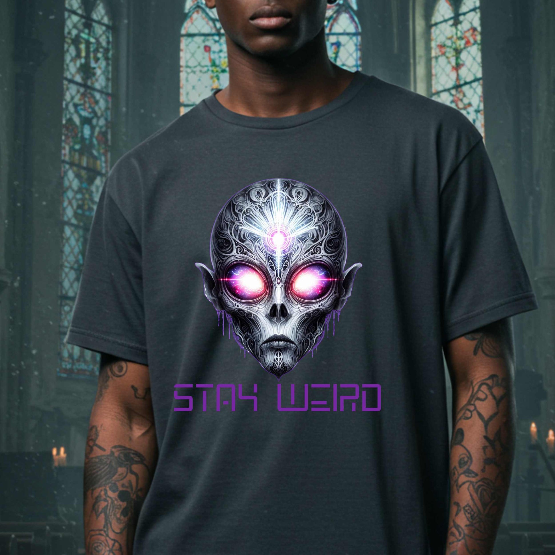 This Stay Weird alien shirt is for the cosmic misfits, the night-dwellers, and the ones who don’t just embrace their weirdness—they glorify it. Featuring a hauntingly detailed alien face with glowing eyes and third-eye vibes, this tee is equal parts spooky, surreal, and unapologetically bold.