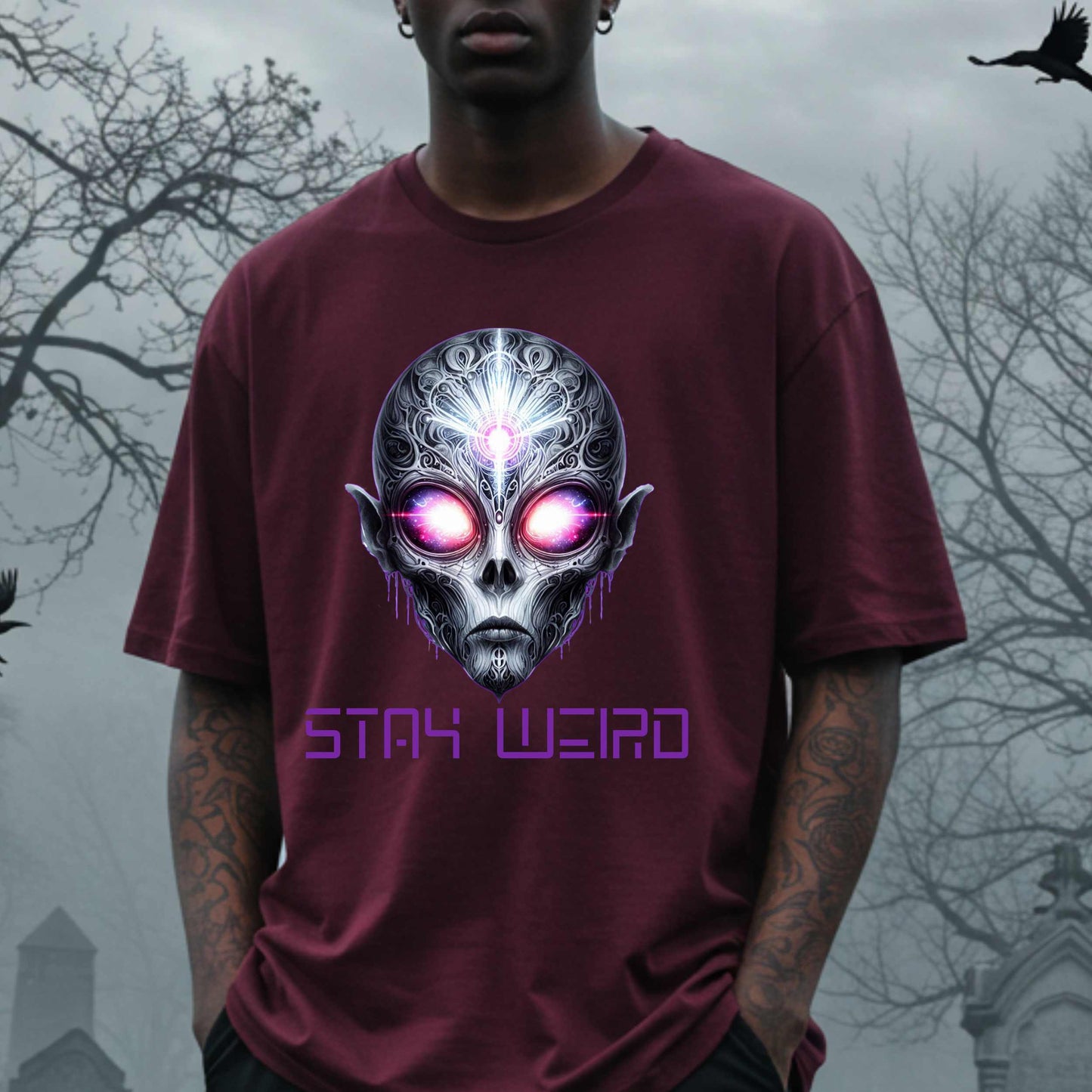 This Stay Weird alien shirt is for the cosmic misfits, the night-dwellers, and the ones who don’t just embrace their weirdness—they glorify it. Featuring a hauntingly detailed alien face with glowing eyes and third-eye vibes, this tee is equal parts spooky, surreal, and unapologetically bold.