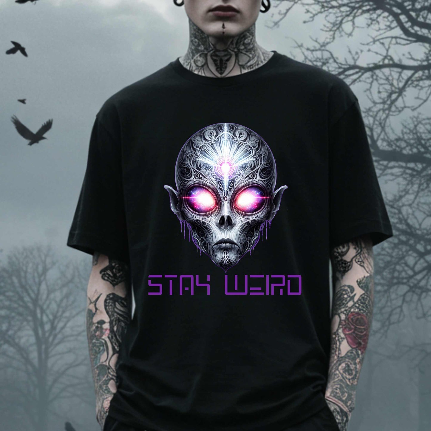 This Stay Weird alien shirt is for the cosmic misfits, the night-dwellers, and the ones who don’t just embrace their weirdness—they glorify it. Featuring a hauntingly detailed alien face with glowing eyes and third-eye vibes, this tee is equal parts spooky, surreal, and unapologetically bold.
