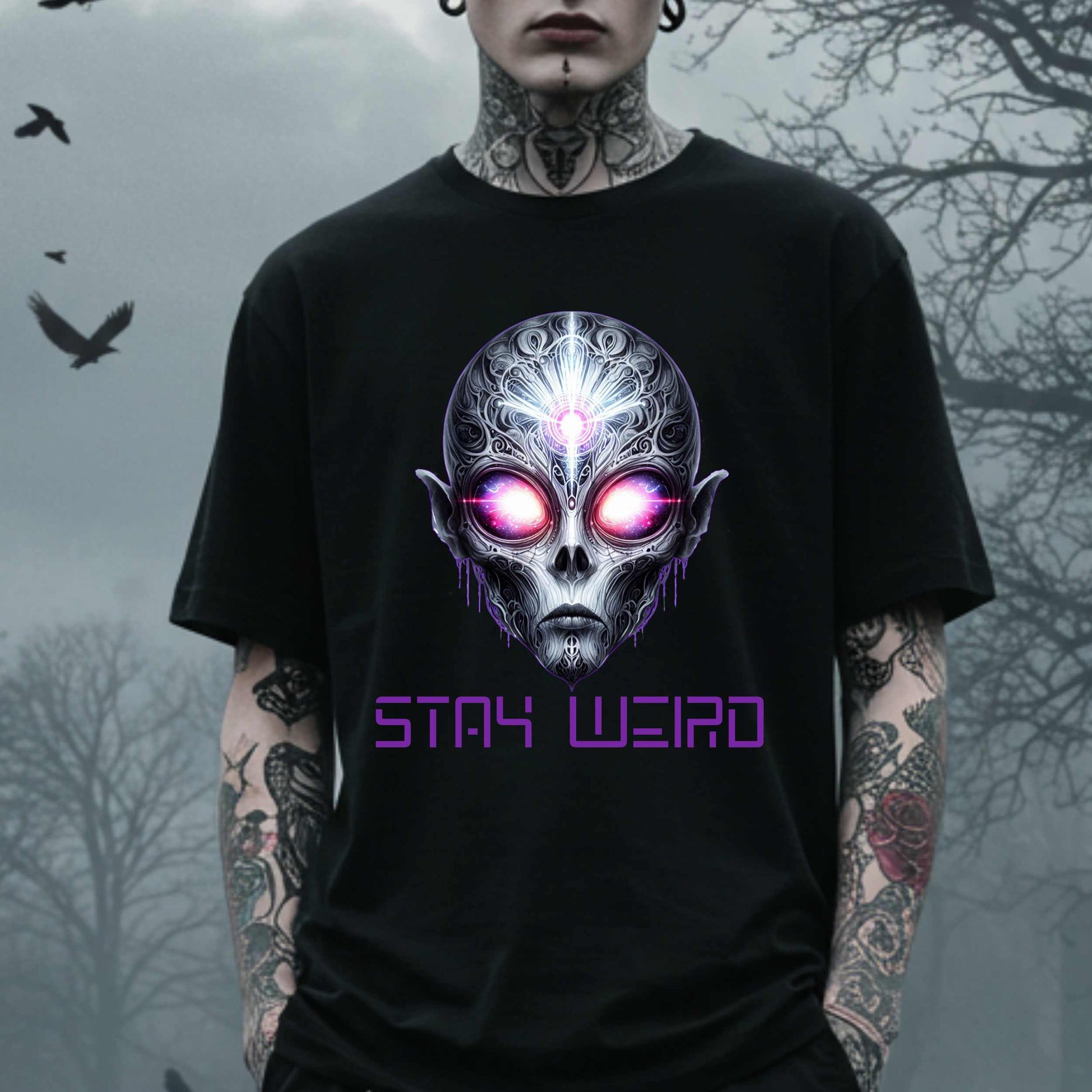 This Stay Weird alien shirt is for the cosmic misfits, the night-dwellers, and the ones who don’t just embrace their weirdness—they glorify it. Featuring a hauntingly detailed alien face with glowing eyes and third-eye vibes, this tee is equal parts spooky, surreal, and unapologetically bold.