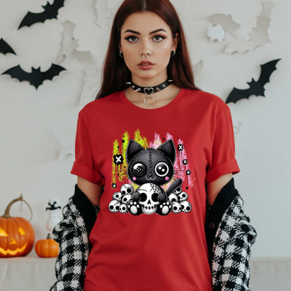 Pastel goth cat Halloween shirt for the spooky babe who wants to be cute, creepy, and slightly unbothered by your opinions. This little stitched-up kitten is sittin’ pretty on a pile of skulls, looking like she just clawed her way out of a haunted Lisa Frank binder. It’s soft, spooky, and a little sinister—just like your mood in October (and let’s be honest, year-round).&nbsp;
