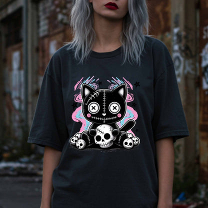 This pastel goth cat Halloween shirt is what happens when adorable meets unhinged. Featuring a stitched-up button-eyed kitten chillin’ on a throne of skulls like it's just another Tuesday, this tee is made for the spooky soul with a soft side (and a slightly murderous glare). Wear it to haunt the streets or just vibe in your villain era—either way, it’s a look.&nbsp;