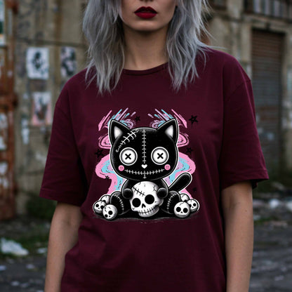 This pastel goth cat Halloween shirt is what happens when adorable meets unhinged. Featuring a stitched-up button-eyed kitten chillin’ on a throne of skulls like it's just another Tuesday, this tee is made for the spooky soul with a soft side (and a slightly murderous glare). Wear it to haunt the streets or just vibe in your villain era—either way, it’s a look.&nbsp;