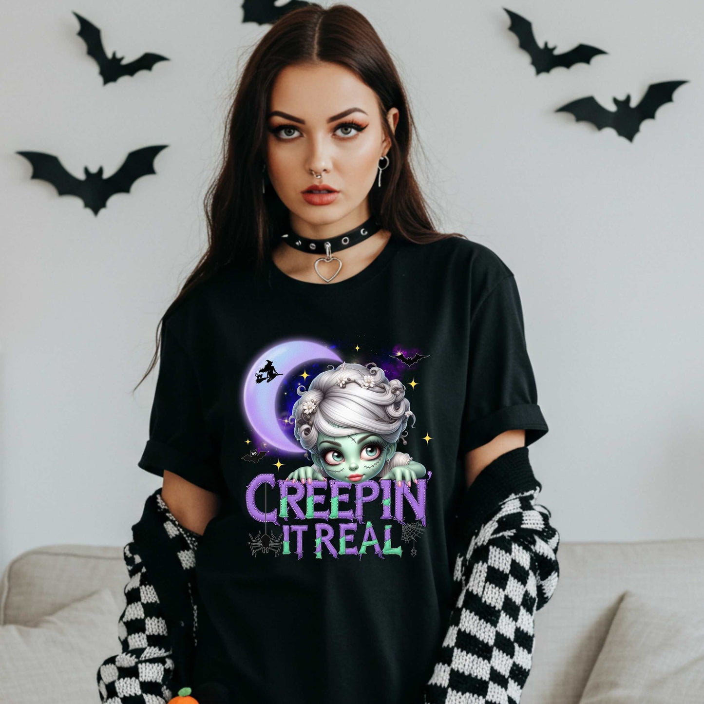 This funny Creepin’ It Real Halloween shirt is the perfect spooky tee for keeping it creepy, cute, and a little unhinged all spooky season long. Who needs subtle when you can be bold, undead, and sarcastically stylish? Whether you're haunting the living room or creeping through the Halloween party like a glam ghoul, this cute creepy graphic tee is a whole October mood. 