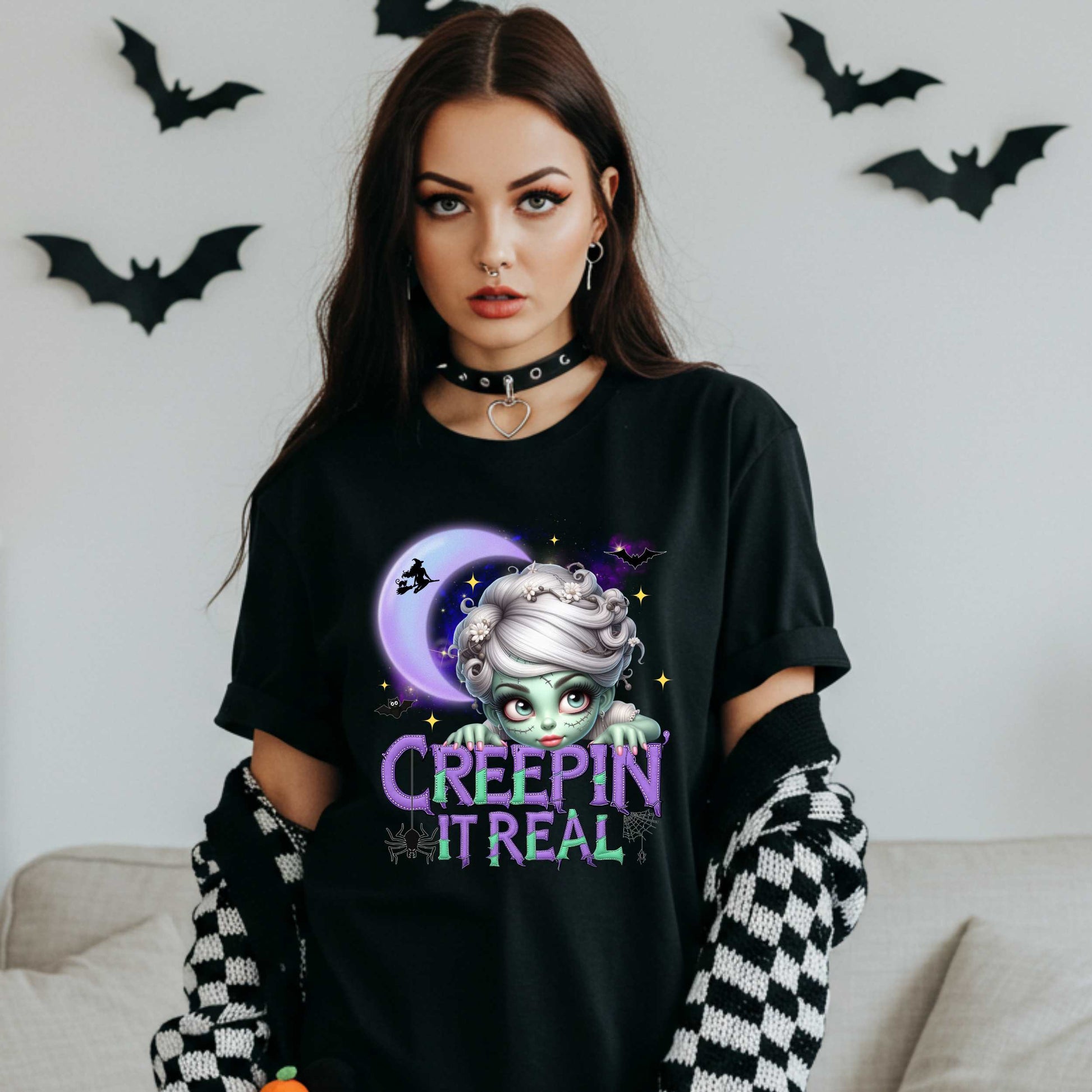 This funny Creepin’ It Real Halloween shirt is the perfect spooky tee for keeping it creepy, cute, and a little unhinged all spooky season long. Who needs subtle when you can be bold, undead, and sarcastically stylish? Whether you're haunting the living room or creeping through the Halloween party like a glam ghoul, this cute creepy graphic tee is a whole October mood. 