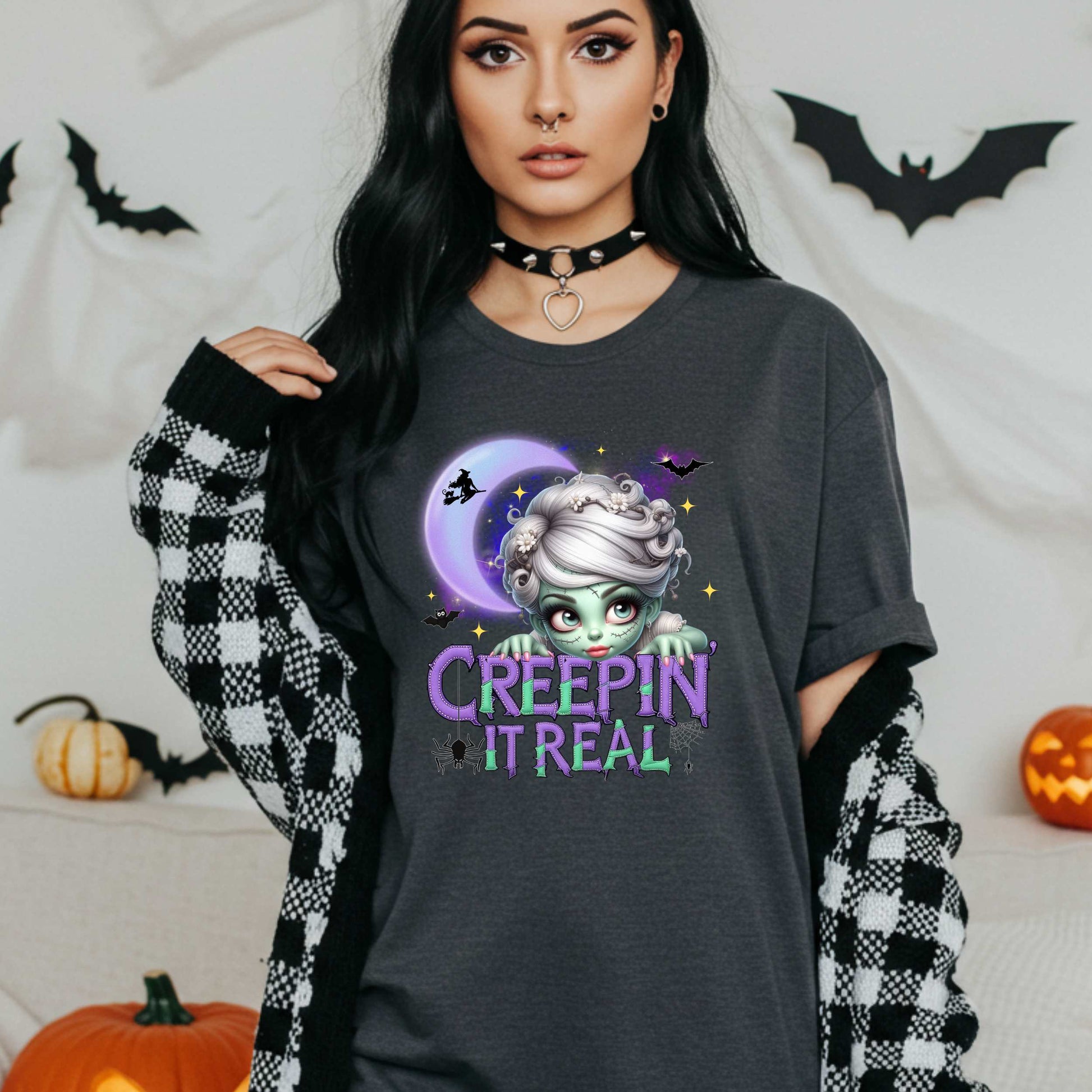 This funny Creepin’ It Real Halloween shirt is the perfect spooky tee for keeping it creepy, cute, and a little unhinged all spooky season long. Who needs subtle when you can be bold, undead, and sarcastically stylish? Whether you're haunting the living room or creeping through the Halloween party like a glam ghoul, this cute creepy graphic tee is a whole October mood. 