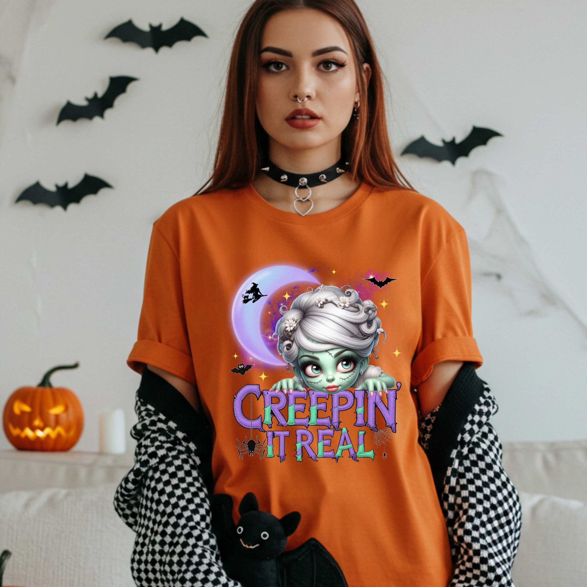 This funny Creepin’ It Real Halloween shirt is the perfect spooky tee for keeping it creepy, cute, and a little unhinged all spooky season long. Who needs subtle when you can be bold, undead, and sarcastically stylish? Whether you're haunting the living room or creeping through the Halloween party like a glam ghoul, this cute creepy graphic tee is a whole October mood. 