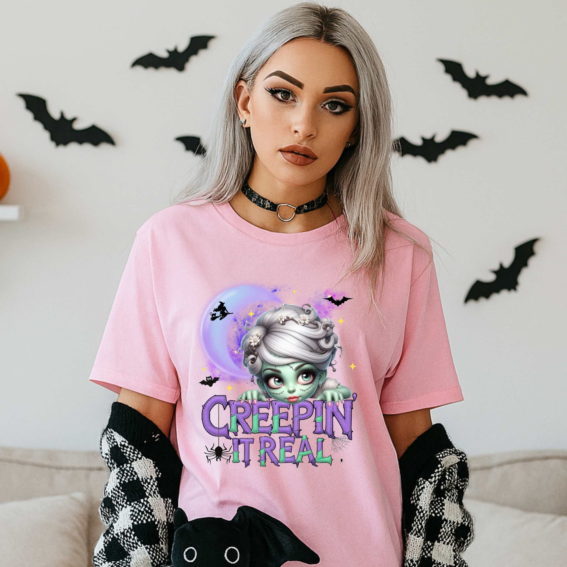 This funny Creepin’ It Real Halloween shirt is the perfect spooky tee for keeping it creepy, cute, and a little unhinged all spooky season long. Who needs subtle when you can be bold, undead, and sarcastically stylish? Whether you're haunting the living room or creeping through the Halloween party like a glam ghoul, this cute creepy graphic tee is a whole October mood. 