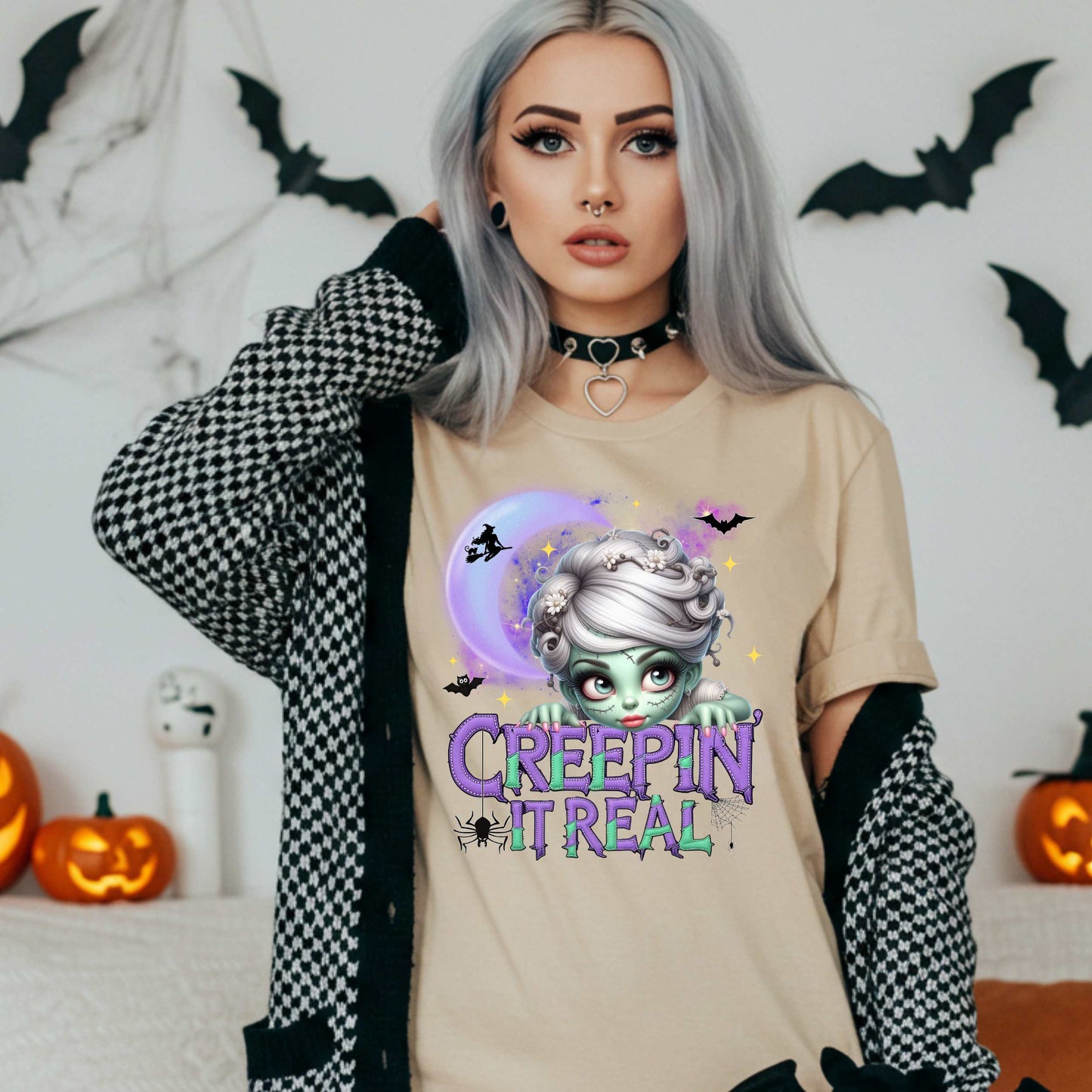 This funny Creepin’ It Real Halloween shirt is the perfect spooky tee for keeping it creepy, cute, and a little unhinged all spooky season long. Who needs subtle when you can be bold, undead, and sarcastically stylish? Whether you're haunting the living room or creeping through the Halloween party like a glam ghoul, this cute creepy graphic tee is a whole October mood. 