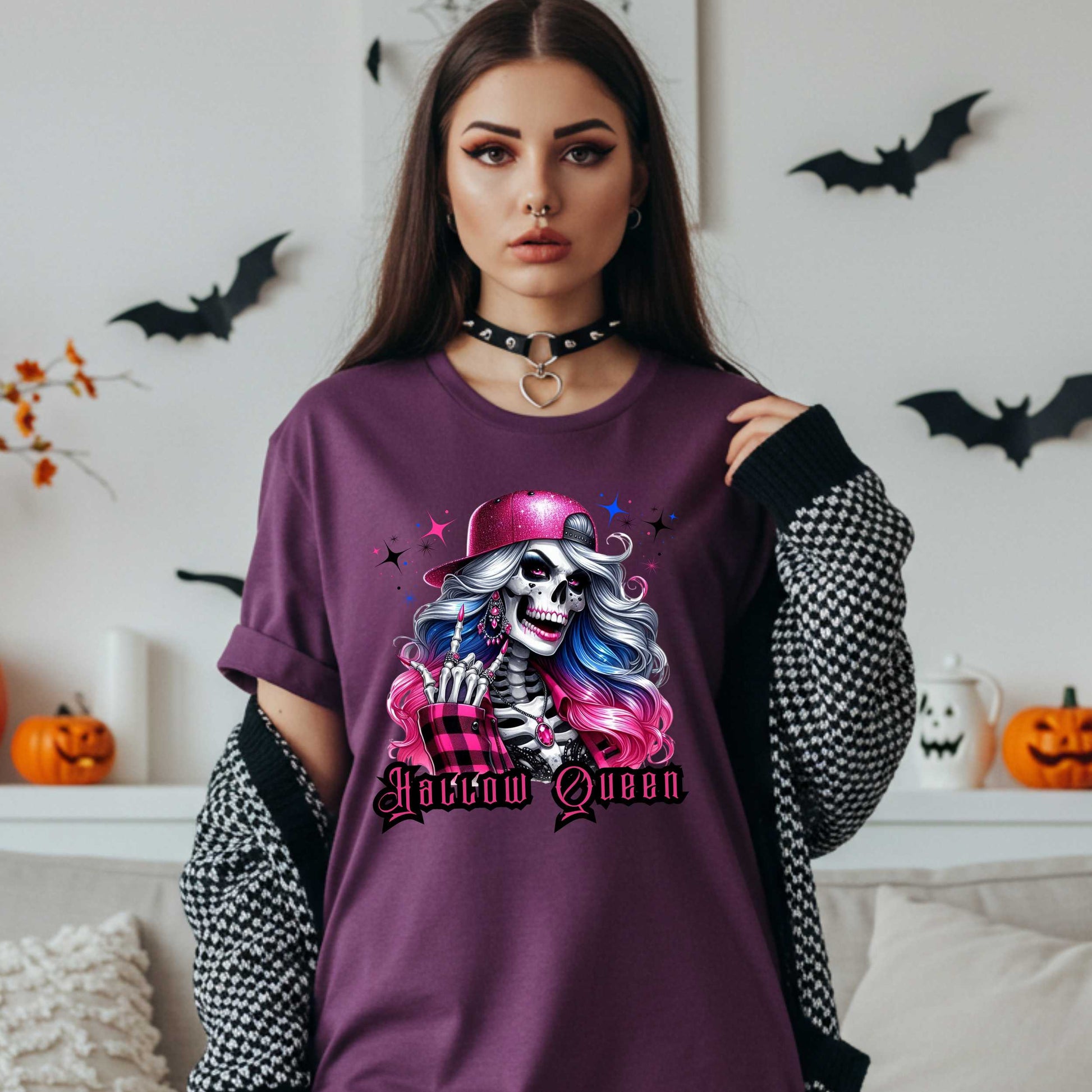 Featuring a glam skeleton with flowing pastel hair, pink flannel, and a glittery hat, she’s clearly been slaying the afterlife runway since 1802. Perfect for the girls who haunt with heels, sparkle under the moonlight, and don’t have time for basic. Serve full-body sass while you sashay through spooky season.