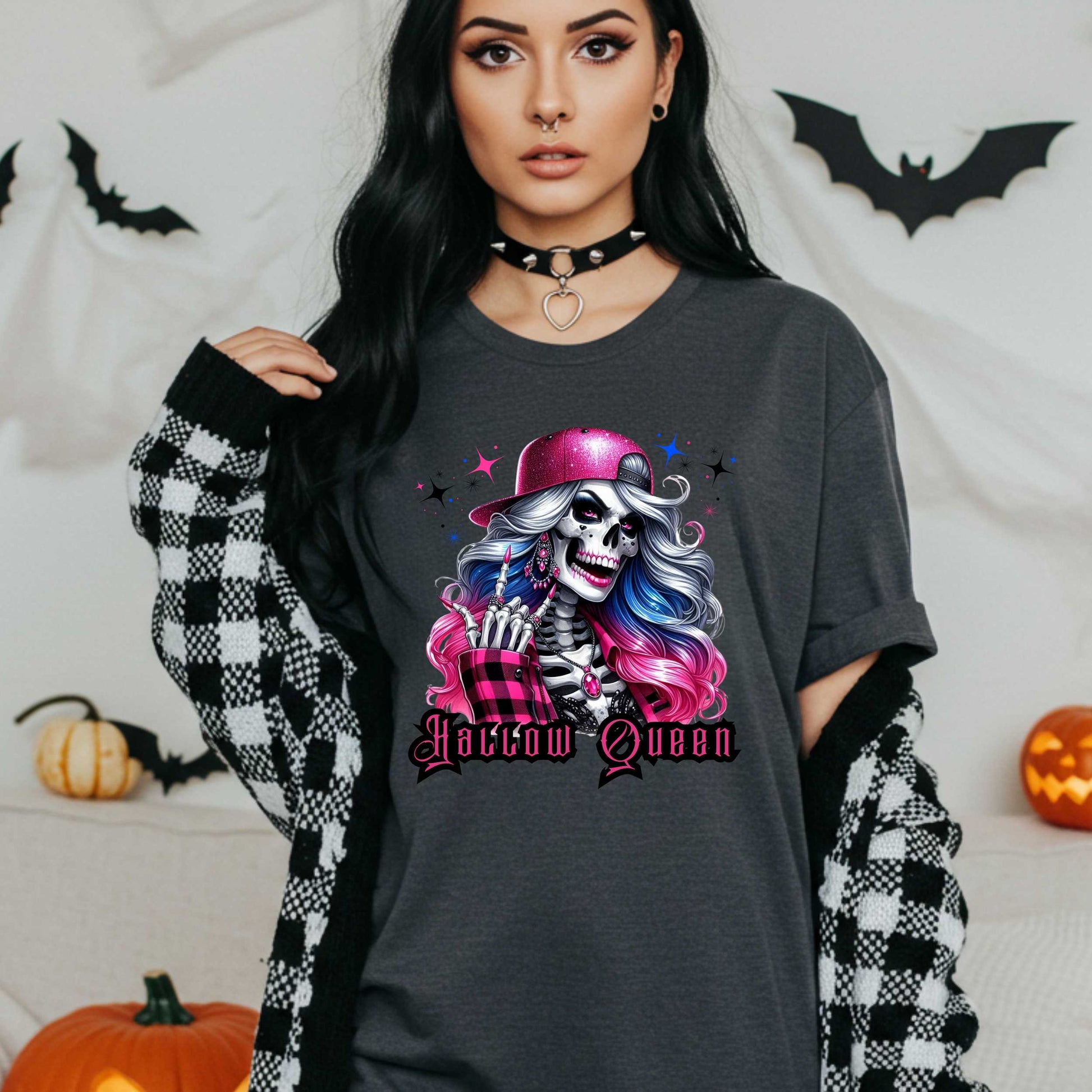 Featuring a glam skeleton with flowing pastel hair, pink flannel, and a glittery hat, she’s clearly been slaying the afterlife runway since 1802. Perfect for the girls who haunt with heels, sparkle under the moonlight, and don’t have time for basic. Serve full-body sass while you sashay through spooky season.