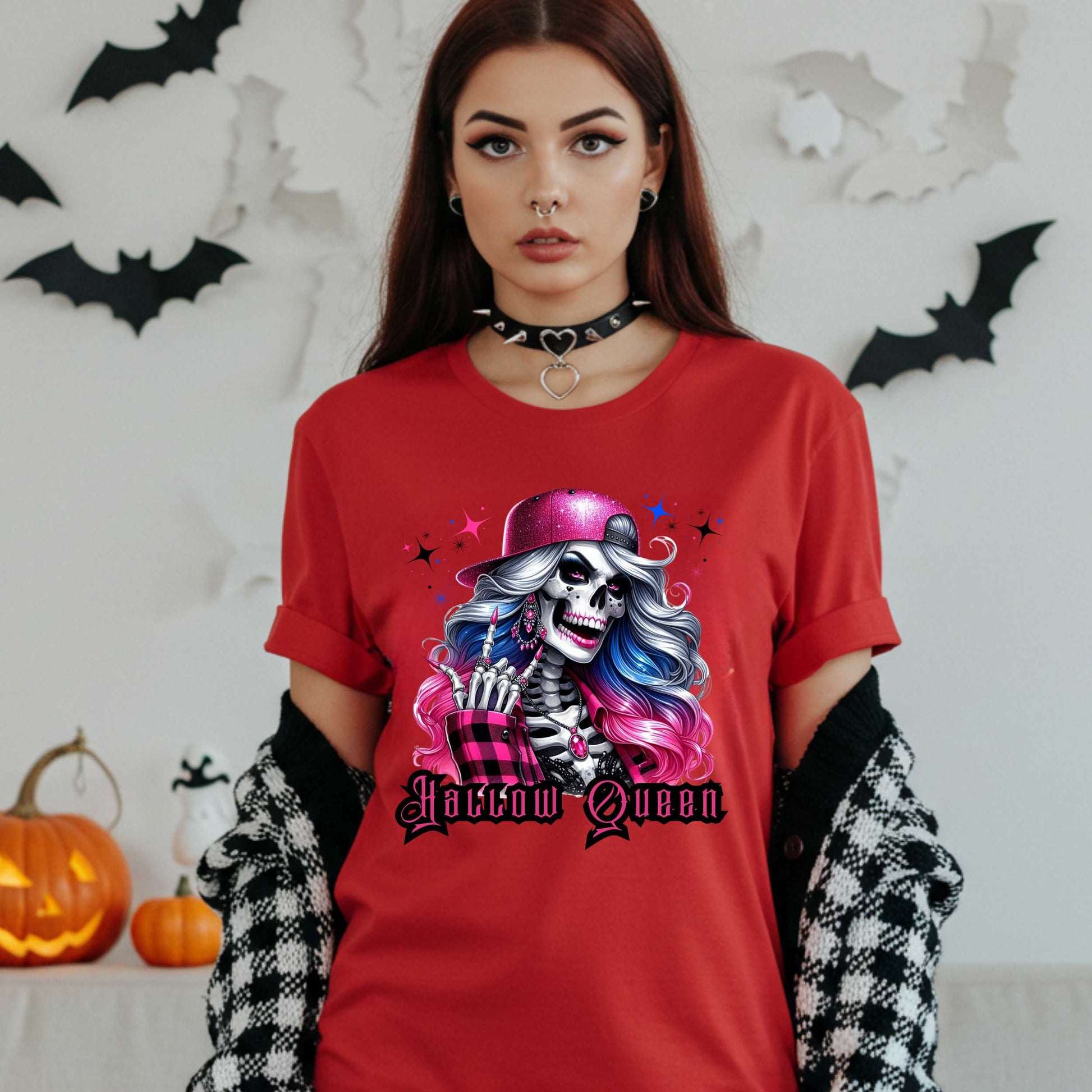 Featuring a glam skeleton with flowing pastel hair, pink flannel, and a glittery hat, she’s clearly been slaying the afterlife runway since 1802. Perfect for the girls who haunt with heels, sparkle under the moonlight, and don’t have time for basic. Serve full-body sass while you sashay through spooky season.