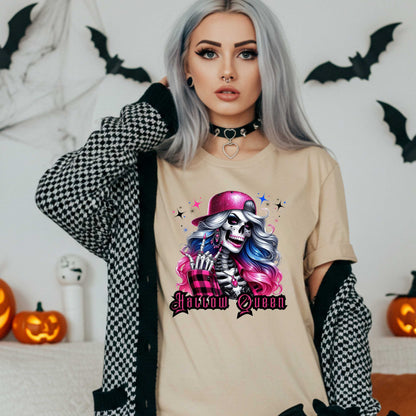 Featuring a glam skeleton with flowing pastel hair, pink flannel, and a glittery hat, she’s clearly been slaying the afterlife runway since 1802. Perfect for the girls who haunt with heels, sparkle under the moonlight, and don’t have time for basic. Serve full-body sass while you sashay through spooky season.