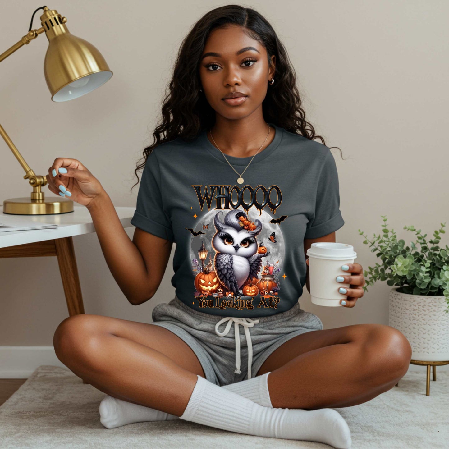 Featuring a glam little night bird serving side-eye and spooky realness, this Halloween tee is equal parts adorable and attitude. Perfect for owl lovers, sass queens, and anyone who prefers their fall fashion with a little shade and a lot of pumpkins.