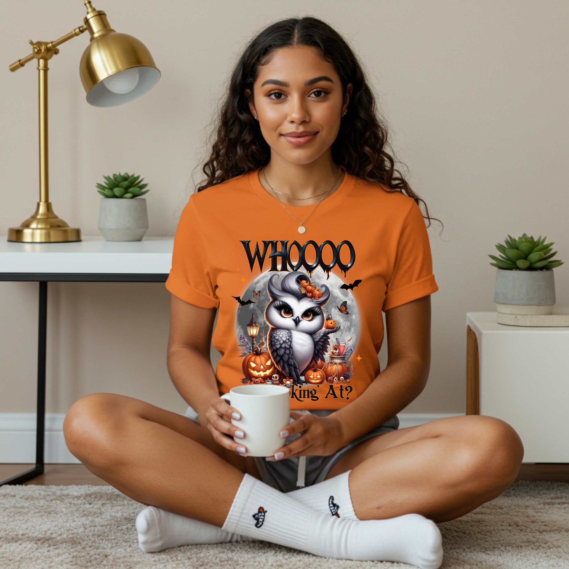Featuring a glam little night bird serving side-eye and spooky realness, this Halloween tee is equal parts adorable and attitude. Perfect for owl lovers, sass queens, and anyone who prefers their fall fashion with a little shade and a lot of pumpkins.