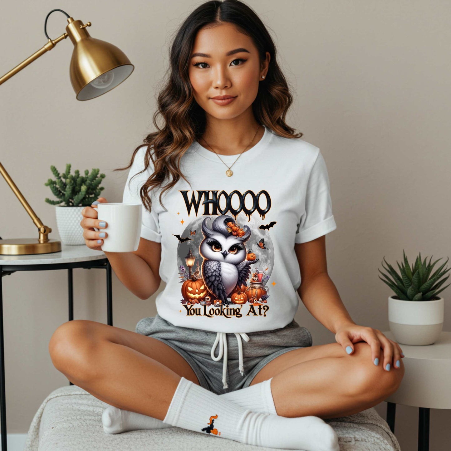 Featuring a glam little night bird serving side-eye and spooky realness, this Halloween tee is equal parts adorable and attitude. Perfect for owl lovers, sass queens, and anyone who prefers their fall fashion with a little shade and a lot of pumpkins.