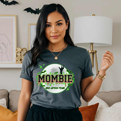 This hilariously relatable Halloween tee is perfect for the spooky season (and honestly, every Monday). With a ghoulish hand rising for coffee and the plea “More Caffeine Please,” this shirt speaks fluent mom and monster. Whether you're chasing kids or caffeine, this tee is your ultimate uniform for the undead-but-still-doing-it life.