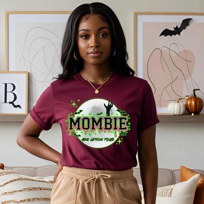 This hilariously relatable Halloween tee is perfect for the spooky season (and honestly, every Monday). With a ghoulish hand rising for coffee and the plea “More Caffeine Please,” this shirt speaks fluent mom and monster. Whether you're chasing kids or caffeine, this tee is your ultimate uniform for the undead-but-still-doing-it life.