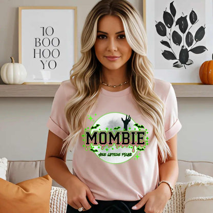 This hilariously relatable Halloween tee is perfect for the spooky season (and honestly, every Monday). With a ghoulish hand rising for coffee and the plea “More Caffeine Please,” this shirt speaks fluent mom and monster. Whether you're chasing kids or caffeine, this tee is your ultimate uniform for the undead-but-still-doing-it life.