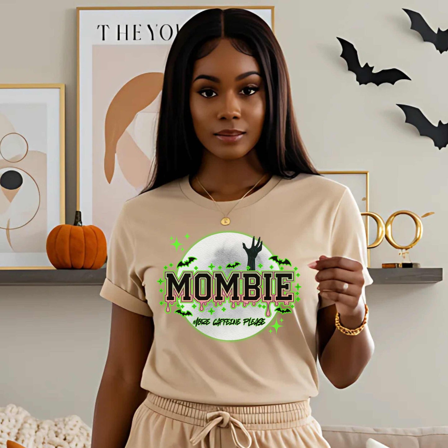 This hilariously relatable Halloween tee is perfect for the spooky season (and honestly, every Monday). With a ghoulish hand rising for coffee and the plea “More Caffeine Please,” this shirt speaks fluent mom and monster. Whether you're chasing kids or caffeine, this tee is your ultimate uniform for the undead-but-still-doing-it life.