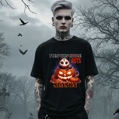 his shirt is for the spooky souls who prefer chaos over cinnamon and guts over glitter. Featuring a bug-eyed opossum with serial killer energy and a face full of pumpkin guts, this tee is perfect for anyone who thinks PSLs are for basic witches and wants to haunt fall fashion in the most unhinged way possible.