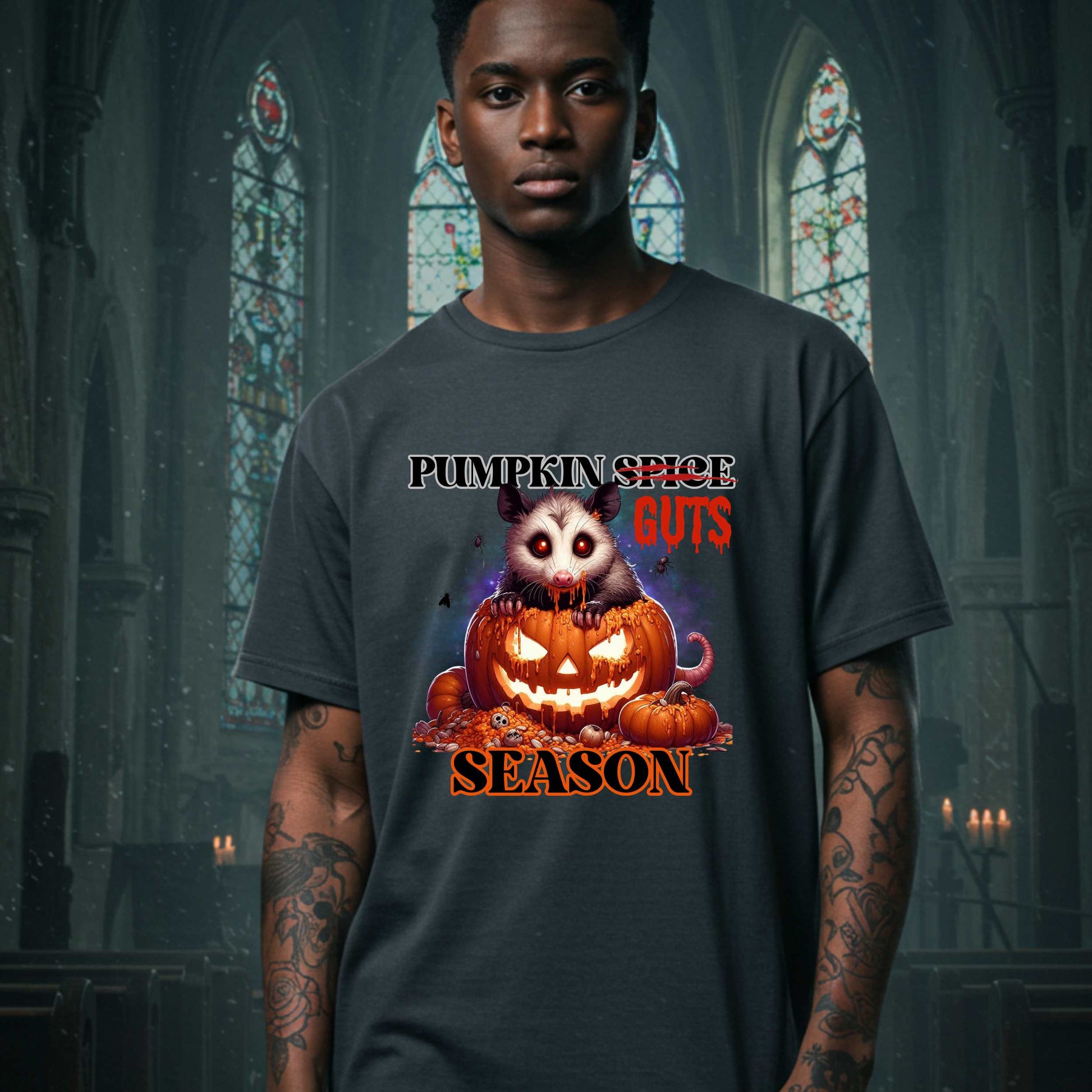 his shirt is for the spooky souls who prefer chaos over cinnamon and guts over glitter. Featuring a bug-eyed opossum with serial killer energy and a face full of pumpkin guts, this tee is perfect for anyone who thinks PSLs are for basic witches and wants to haunt fall fashion in the most unhinged way possible.
