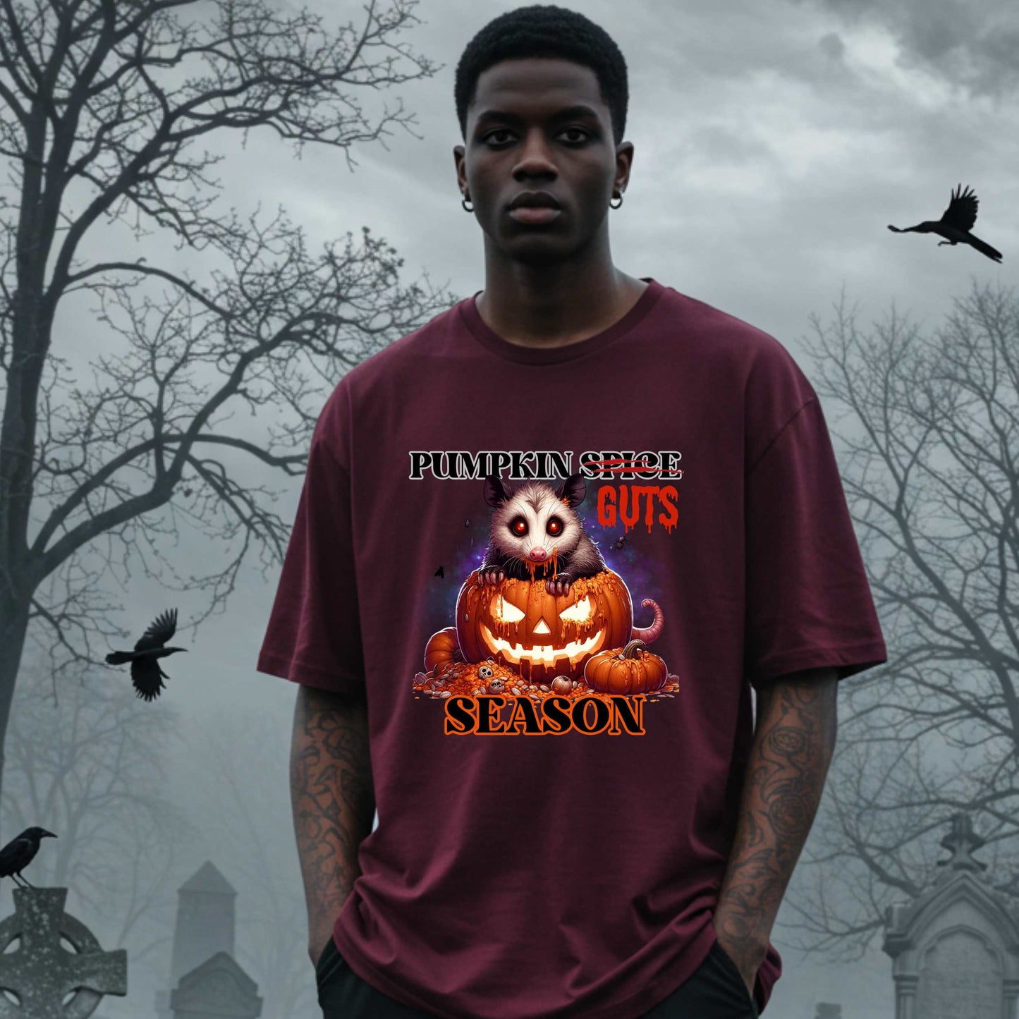 his shirt is for the spooky souls who prefer chaos over cinnamon and guts over glitter. Featuring a bug-eyed opossum with serial killer energy and a face full of pumpkin guts, this tee is perfect for anyone who thinks PSLs are for basic witches and wants to haunt fall fashion in the most unhinged way possible.