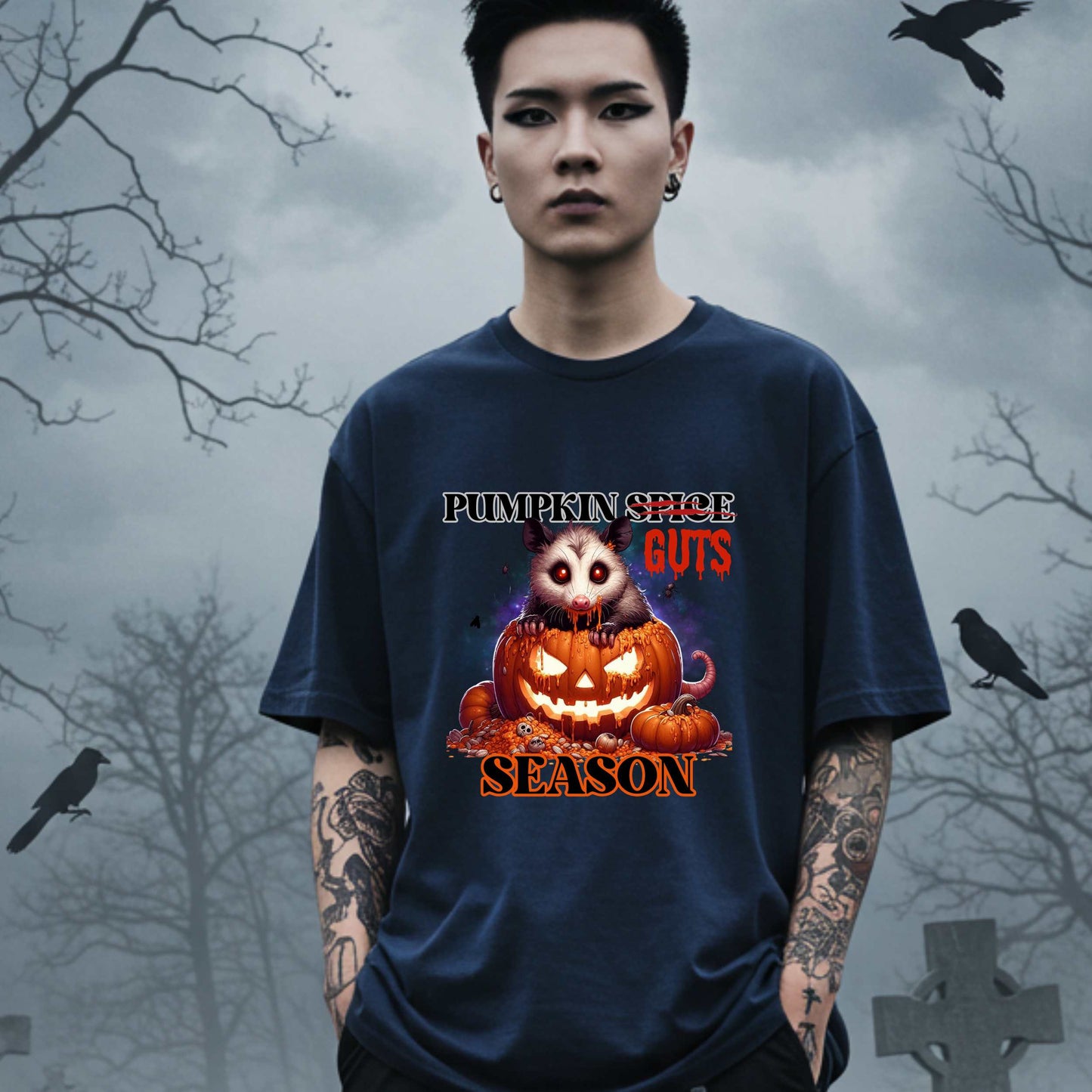 his shirt is for the spooky souls who prefer chaos over cinnamon and guts over glitter. Featuring a bug-eyed opossum with serial killer energy and a face full of pumpkin guts, this tee is perfect for anyone who thinks PSLs are for basic witches and wants to haunt fall fashion in the most unhinged way possible.