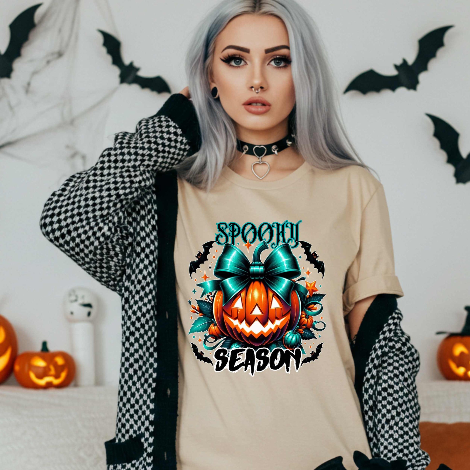 Step aside basic witches, this pumpkin came to SLAY. Our Spooky Season tee brings the perfect mix of creepy and cute—featuring a fierce jack-o’-lantern crowned with a bold teal bow and surrounded by gothic glam accents.
