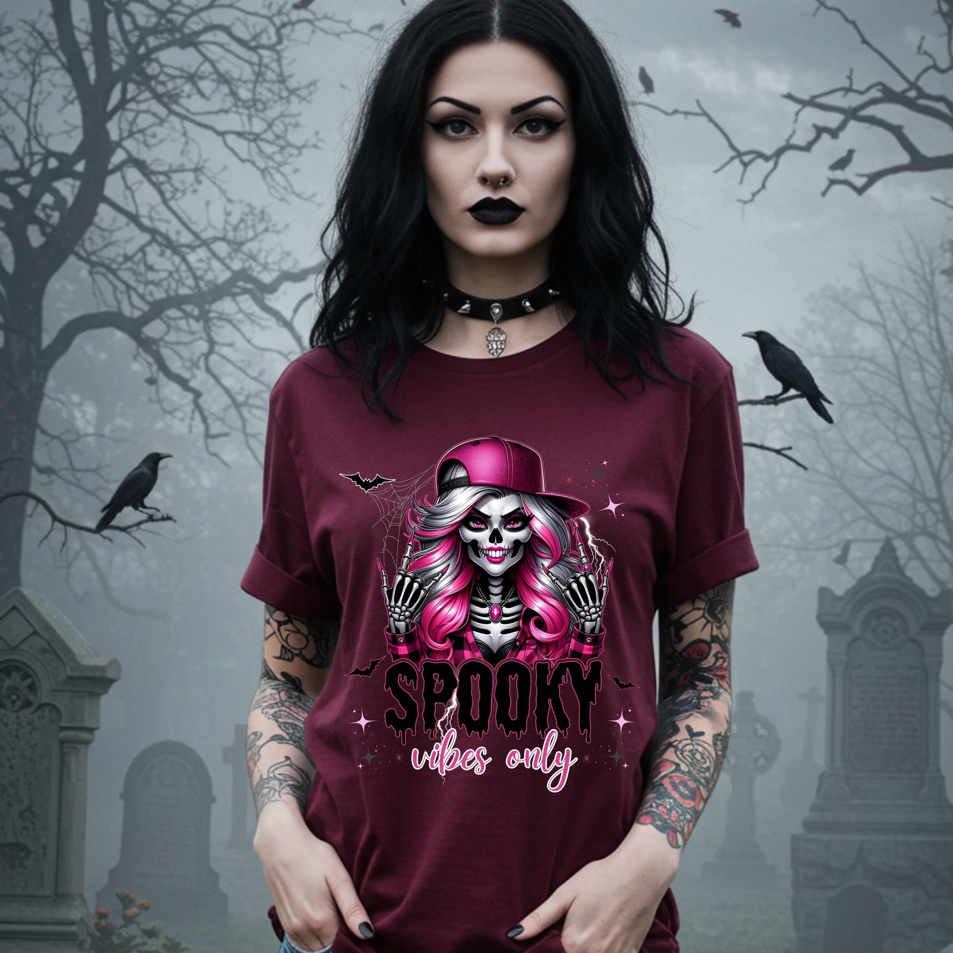  This Spooky Vibes Only tee is the perfect blend of glam and goth, featuring a pink-haired skeleton baddie with nails sharp enough to slash a pumpkin and a hat tilted like she’s haunting the runway. This shirt is for the ghouls who don’t do basic. 