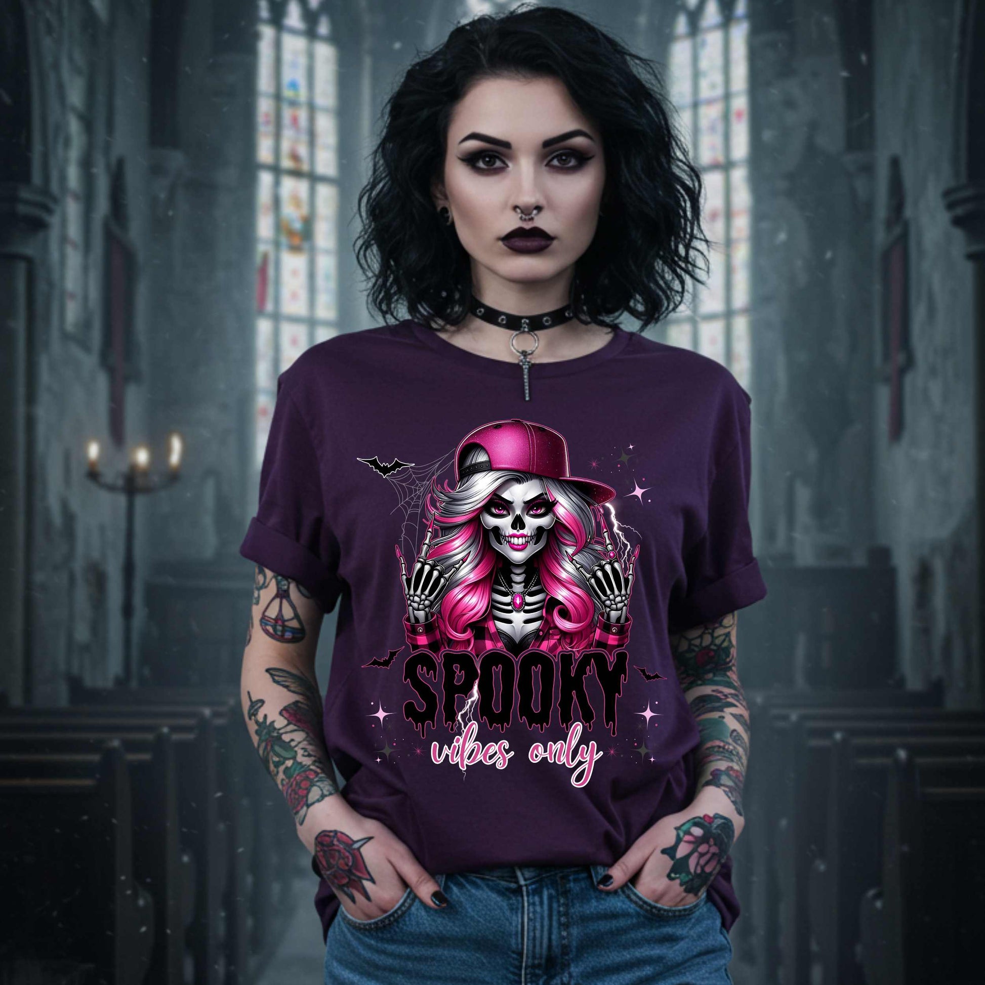  This Spooky Vibes Only tee is the perfect blend of glam and goth, featuring a pink-haired skeleton baddie with nails sharp enough to slash a pumpkin and a hat tilted like she’s haunting the runway. This shirt is for the ghouls who don’t do basic. 