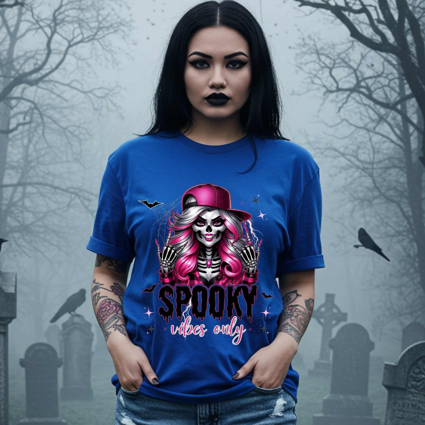  This Spooky Vibes Only tee is the perfect blend of glam and goth, featuring a pink-haired skeleton baddie with nails sharp enough to slash a pumpkin and a hat tilted like she’s haunting the runway. This shirt is for the ghouls who don’t do basic. 