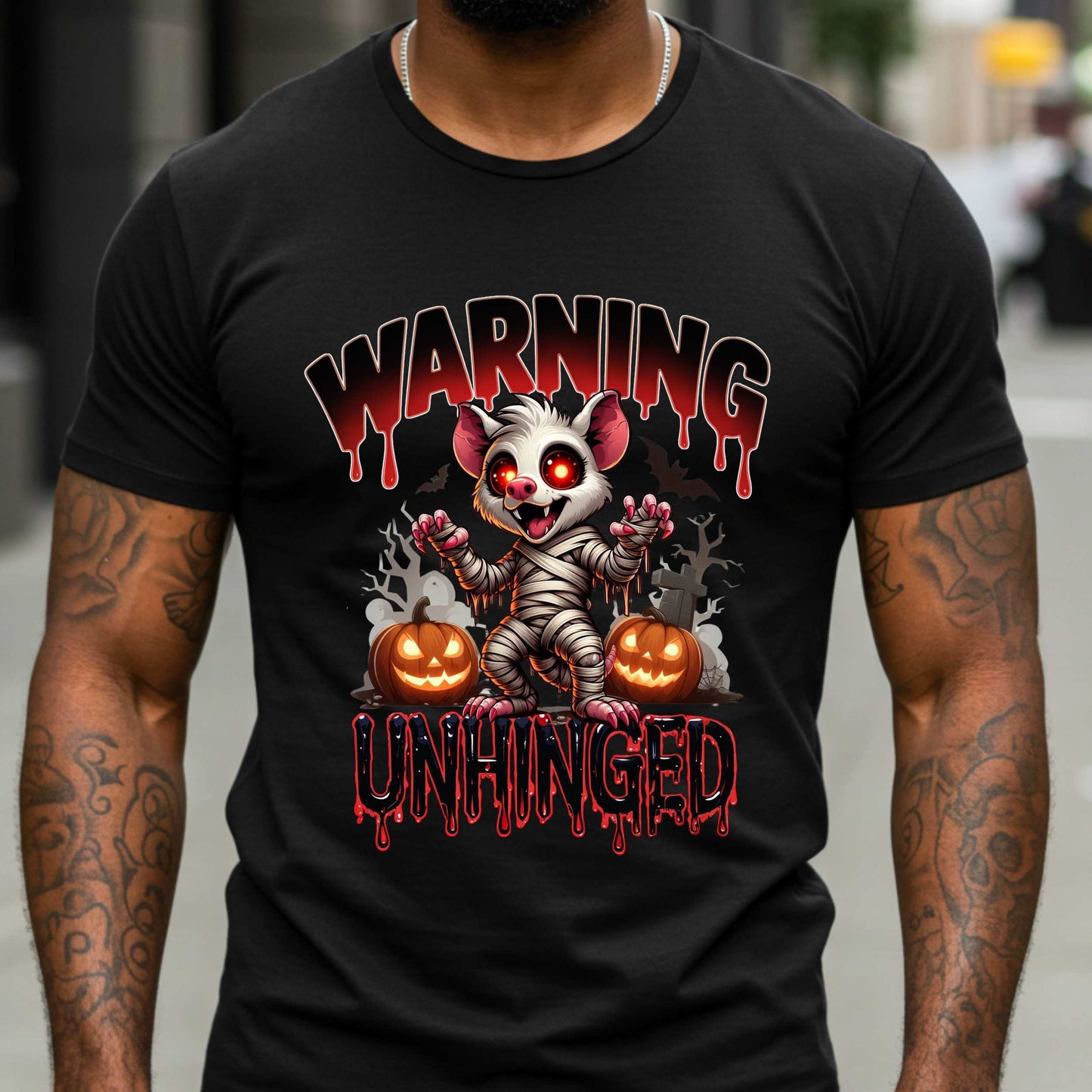 Wrapped in mummy rags with glowing red eyes and the energy of a sleep-deprived raccoon on espresso, this Warning: Unhinged tee is perfect for anyone who thrives on spooky vibes, sarcasm, and just a little bit of feral energy. Whether you're scaring off the normies or just embracing your inner mess, this is your new Halloween uniform.