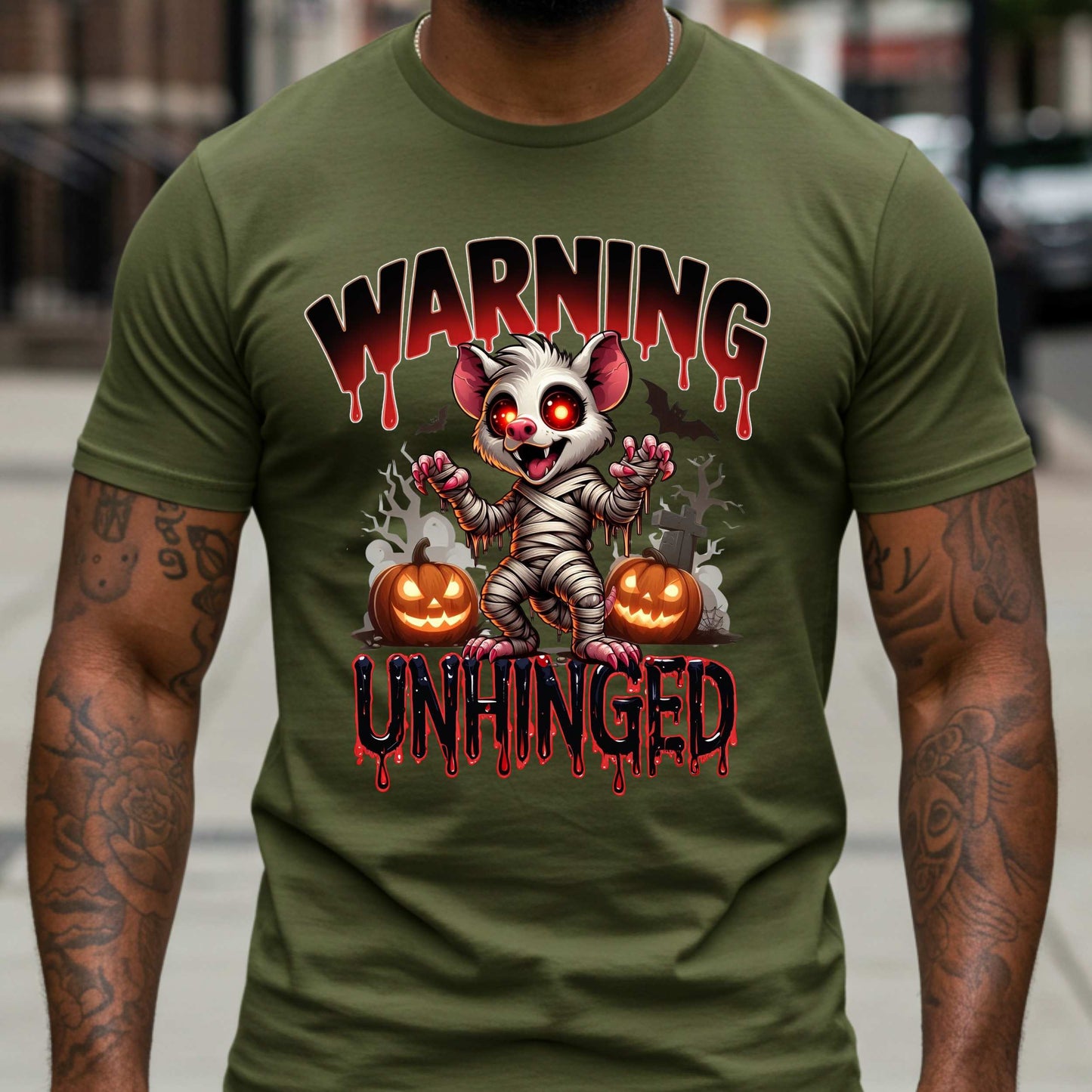 Wrapped in mummy rags with glowing red eyes and the energy of a sleep-deprived raccoon on espresso, this Warning: Unhinged tee is perfect for anyone who thrives on spooky vibes, sarcasm, and just a little bit of feral energy. Whether you're scaring off the normies or just embracing your inner mess, this is your new Halloween uniform.