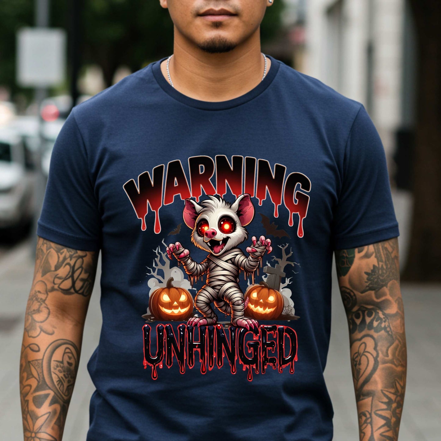 Wrapped in mummy rags with glowing red eyes and the energy of a sleep-deprived raccoon on espresso, this Warning: Unhinged tee is perfect for anyone who thrives on spooky vibes, sarcasm, and just a little bit of feral energy. Whether you're scaring off the normies or just embracing your inner mess, this is your new Halloween uniform.